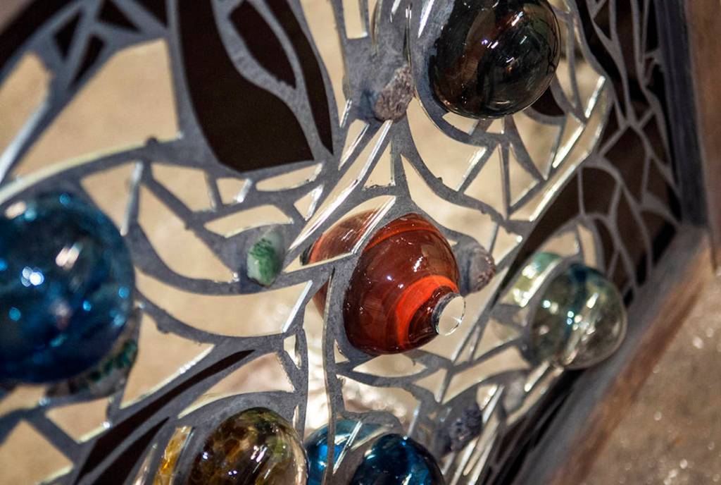 This dynamic 30- by 32.5-inch piece was created by local glass artists Michelle Lester and Jeremy Bartheld.
