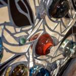 This dynamic 30- by 32.5-inch piece was created by local glass artists Michelle Lester and Jeremy Bartheld.