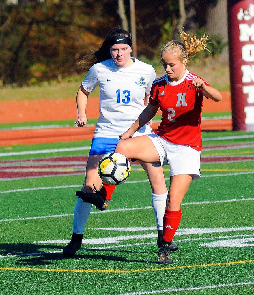 Hoquiams Sadie Carlyle shields the ball from Elmas Taylor Kershaw in the first half of a district play-in game on Saturday in Montesano. (Hasani Grayson | Grays Harbor News Group)