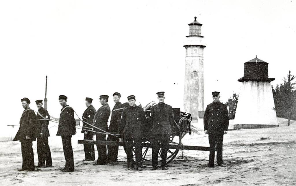 COURTESY WESTPORT-SOUTH BEACH HISTORICAL SOCIETY                                The U.S. Life Saving Service, which later became the Coast Guard, established a station at the end of what is now Ocean Avenue in Westport in 1897. Here a Life Saving Service Crew trains in front of the Westport Lighthouse, which was put in service the year after the Life Saving Service station was established.