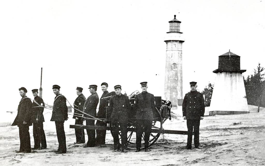 COURTESY WESTPORT-SOUTH BEACH HISTORICAL SOCIETY                                The U.S. Life Saving Service, which later became the Coast Guard, established a station at the end of what is now Ocean Avenue in Westport in 1897. Here a Life Saving Service Crew trains in front of the Westport Lighthouse, which was put in service the year after the Life Saving Service station was established.