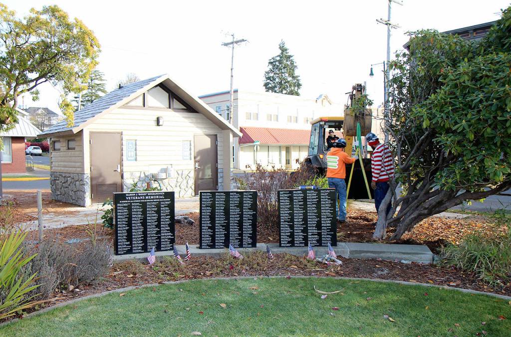 City of Montesano and Aberdeen Cemetery Association personnel add a fourth marble monument to the Marion J. Bogey Bogdanovich Veterans Honor Wall on Thursday, Oct. 31, 2019, at Fleet Park in Montesano. (Michael Lang | Grays Harbor News Group)