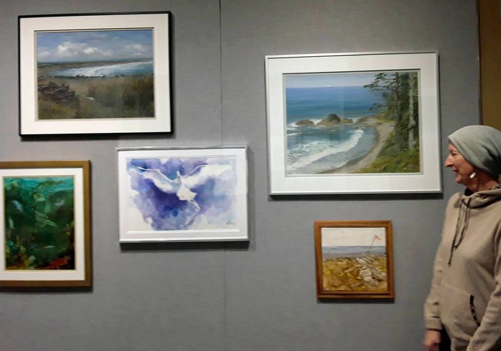 Sue Lowatchie surveys the collection of works she has at the gala.