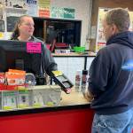 Kat Bryant | Grays Harbor News Group                                Former employee Arnie Ekman chats with 30-year store manager Kellie Nordberg over his final purchases at the Hoquiam Ace Hardware on Friday.