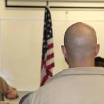 COURTESY PHOTO                                Inmates look at the flag during an American Legion meeting at Stafford Creek Corrections Center Oct. 16.