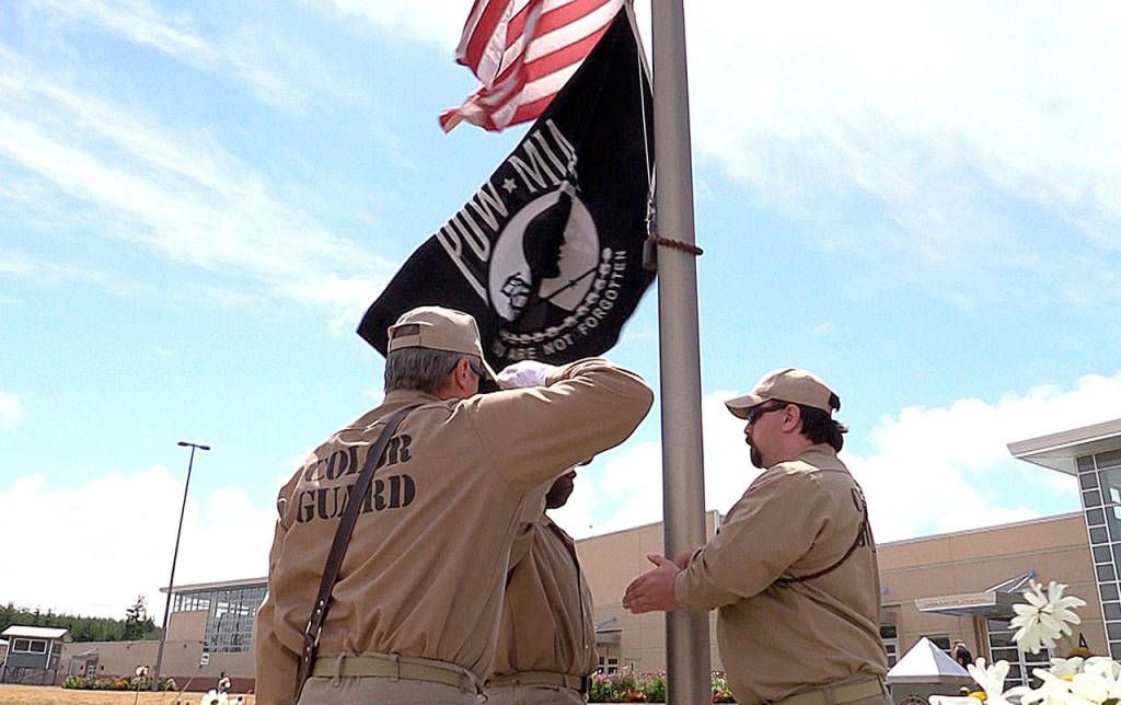 DEPARTMENT OF CORRECTIONS FILE PHOTO                                Veterans incarcerated in Stafford Creek Corrections Center salute the United States and POW/MIA flags. The prison has become the site of an official American Legion Post.