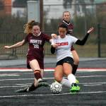 Montesanos Brooke Streeter (10) contests Teninos Iris Campesino for possession during the 1A District IV championship game on Saturday in Tenino. (Photo by Shawn Donnelly)