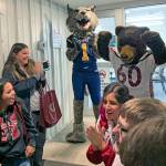 Kat Bryant | Grays Harbor News Group                                Aberdeens Bobcat mascot applauds Hoquiams Grizzly on Tuesday evening as they break the news that Hoquiam won this years Food Ball competition.