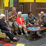 Nick (Chris Fruto, second from right) tries to guide his grandparents (from left, Louise Hoover, Judy Ball, Eddie Logue and Keith Krueger) through a game of Trivial Pursuit.