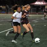 Montesano forward Anna Ayres, right, holds possession against The Bush Schools Claudia Abram during the Bulldogs 2-1 loss against the Blazers in a 1A State Tournament game on Wednesday at Montesano High School. (Ryan Sparks | Grays Harbor News Group)