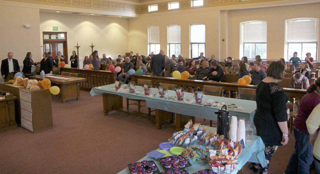 A packed court room Friday awaits the National Adoption Day ceremony at Grays Harbor County Superior Court in Montesano. (Michael Lang | Grays Harbor News Room)