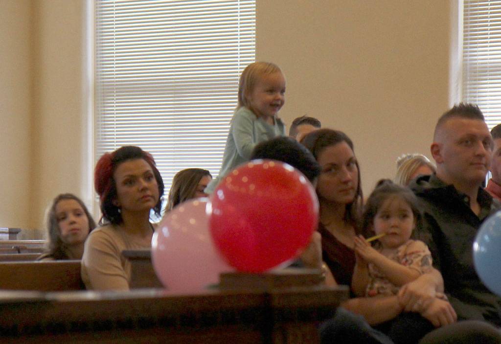 A girl waits patiently Friday during the National Adoption Day ceremony in Judge Stephen Browns courtroom at Grays Harbor County Superior Court in Montesano. (Michael Lang | Grays Harbor News Group)