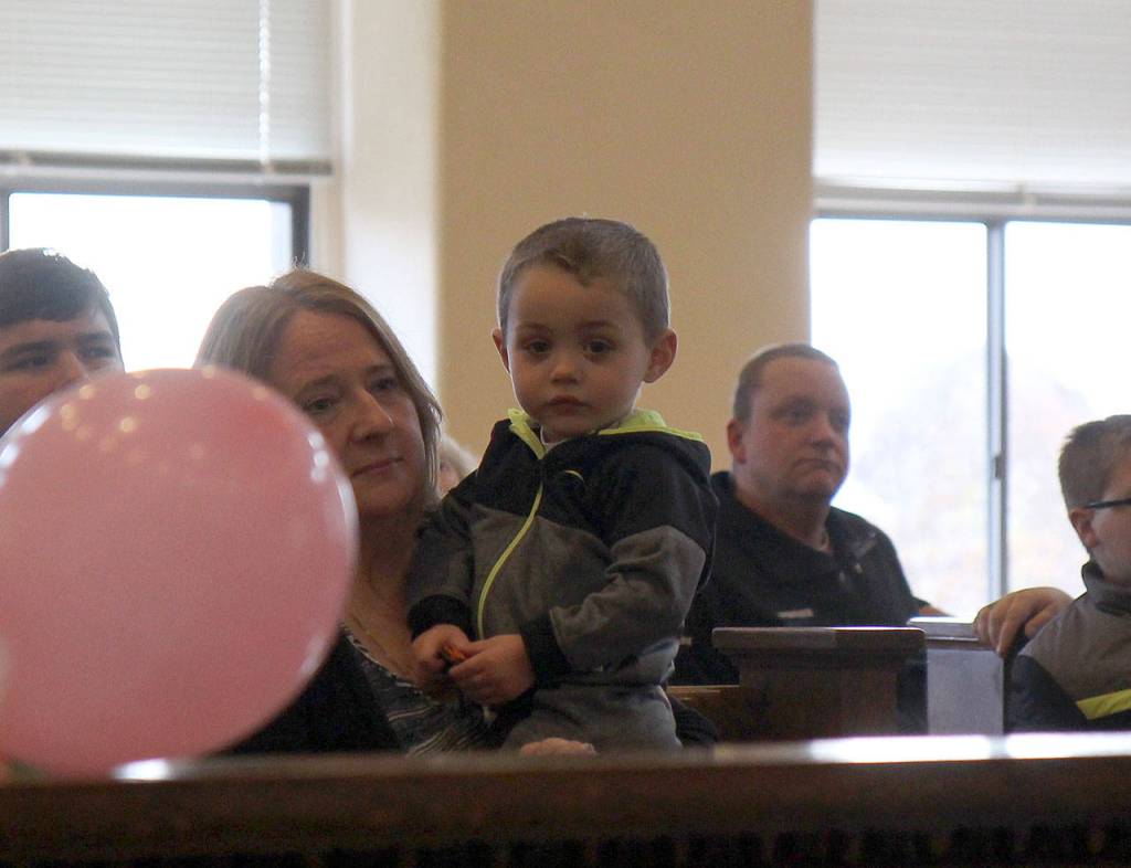 Kasyn waits to be adopted by Steven and Lorna White on Friday during the National Adoption Day ceremony in Judge Stephen Browns courtroom at Grays Harbor County Superior Court in Montesano. (Michael Lang | Grays Harbor News Group)
