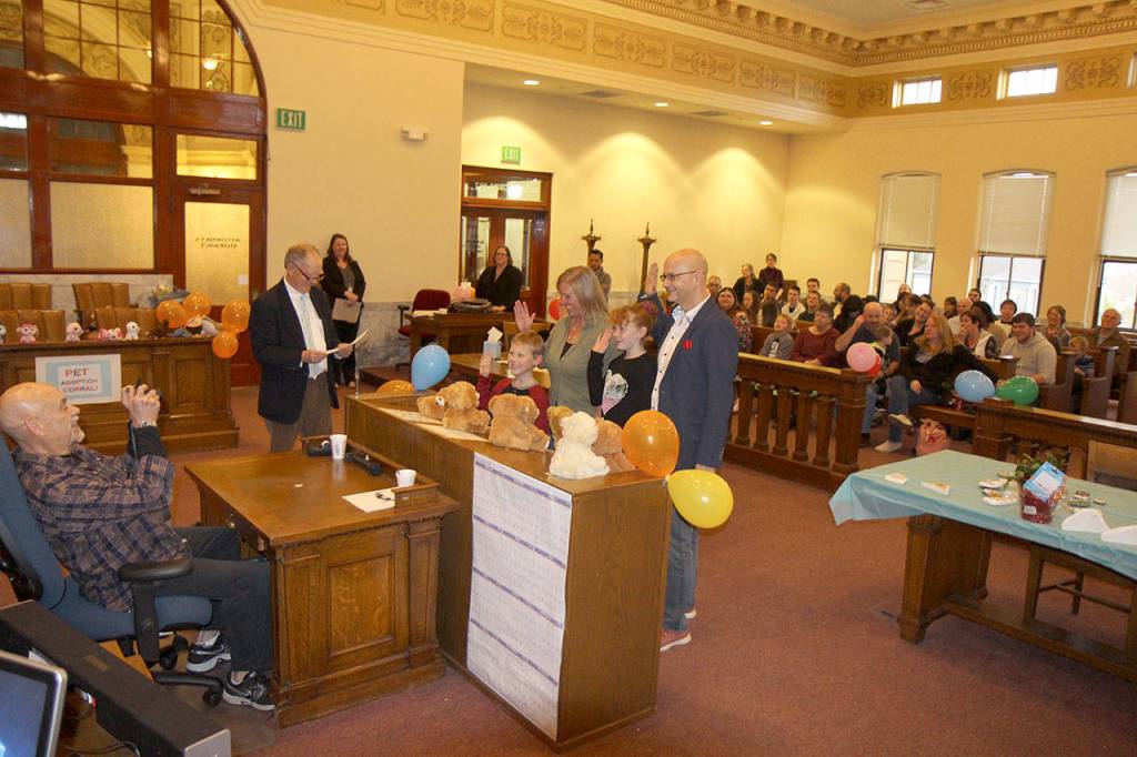 The Robles family (center) is sworn in Friday during the National Adoption Day ceremony in Judge Stephen Browns courtroom at Grays Harbor County Superior Court in Montesano. (Michael Lang | Grays Harbor News Group)