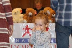 Sawyer Drake tries to contain her excitement about getting a new cousin Friday during the National Adoption Day ceremony in Judge Stephen Browns courtroom at Grays Harbor County Superior Court in Montesano. (Michael Lang | Grays Harbor News Group)