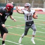 Hoquiam running back Malaki Eaton (10) carries the football against Mount Bakers Mason Jacoby during the Grizzlies 36-21 loss in the first round of the 1A State Football Tournament on Saturday in Bellingham. (Eric Trent | Lynden Tribune)