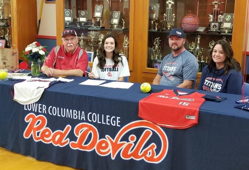 Submitted photo Willapa Valleys Katelyn McGough (second from left) signed a National Letter of Intent to play softball for Lower Columbia on Nov. 2. Pictured with Katelyn are (from left) Willapa Valley head softball coach Ken Olsen and parents Ron and Sheila McGough.