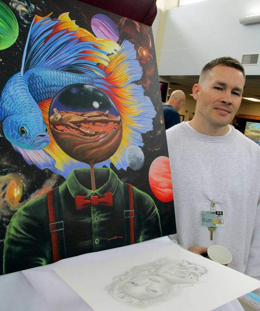Photos by Kat Bryant | Grays Harbor News Group                                Jason had several pieces in various styles on display, but it was this surrealist painting that evoked a lengthy conversation. It kind of represents me sitting in prison, he said. Im not really here; Im physically here, but Im off doing this stuff somewhere else. It helps me do my time.