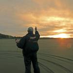 Dave Murnen takes a windspeed reading near the Ocean Shores jetty just after dawn.