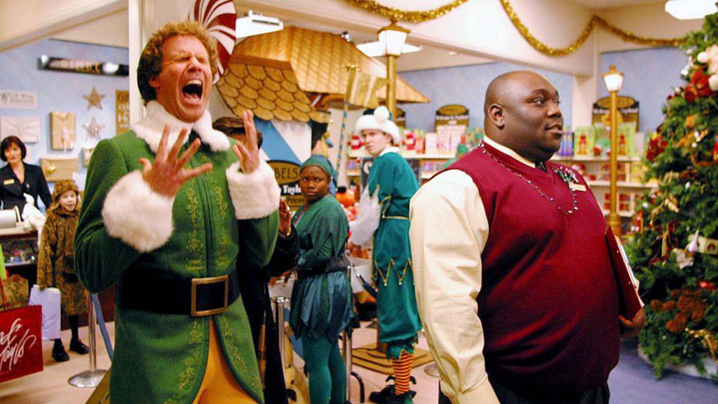 Will Ferrell plays Buddy the Elf and Faizon Love as the Gimbels toy department manager in a scene from Elf. The movie is one of the earliest directed by John Favreau, who also has a small part in the film. (New Line Cinema)