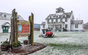 COURTESY PHOTO                                Santas sleigh parked in front of the Westport Maritime Museum amid a light dusting of snow.