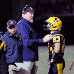 Aberdeen football head coach Todd Bridge, middle, provides instruction to Garrett Springer during a game earlier this season. Bridge and the Bobcats were awarded with the South Sound Football Officials Associations Sportsmanship Award for 2A, 3A and 4A schools on Monday. (Ryan Sparks |Grays Harbor News Group)