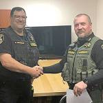 COURTESY PACIFIC COUNTY SHERIFFS OFFICE                                Pacific County Sheriff Robin Souvenir, right, and new Pacific County E911 Director Ed Heffernan.