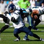 Seattle Seahawks middle linebacker Bobby Wagner (54) intercepts a pass intended for Carolina Panthers wide receiver Chris Hogan (15) as defensive back Lano Hill (42) blocks him during the first half at Bank of America Stadium on Sunday, Dec. 15, 2019. (David T. Foster III/Charlotte Observer/TNS)