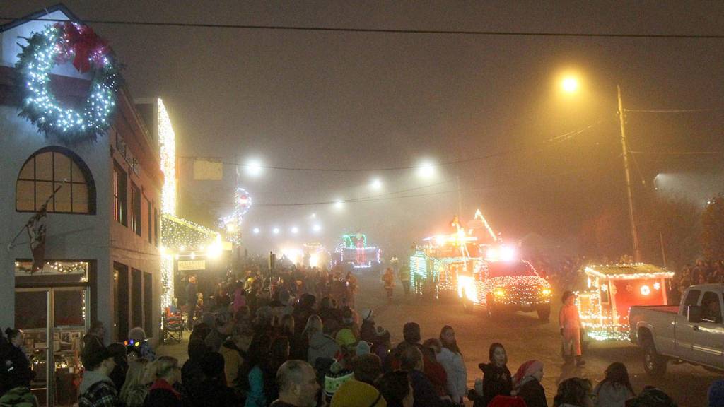 Photos by Michael Lang | Grays Harbor News Group                                A stream of lighted vehicles makes its way down Main Street during the Festival of Lights parade Saturday in Montesano.