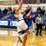 Willapa Valleys Katie Adkins scores two points against Ocosta on Wednesday in Menlo. Adkins scored 11 points and grabbed eight rebounds in the Vikings 50-17 win over the Wildcats. (Photo by Larry Bale)