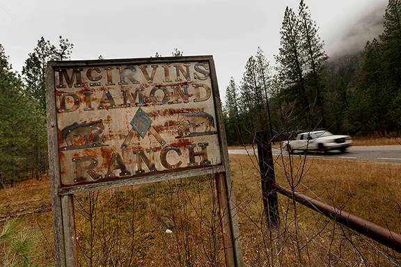 An old sign marks the entrance to the McIrvins Diamond M Ranch in Boyd. The family of Bill McIrvin are owners of the Diamond M ranch, where they raise cattle. According to wolf advocates, the Diamond M ranch is responsible for 28 of 31 wolves taken out in Washington by state officials. (Carolyn Cole/Los Angeles Times)