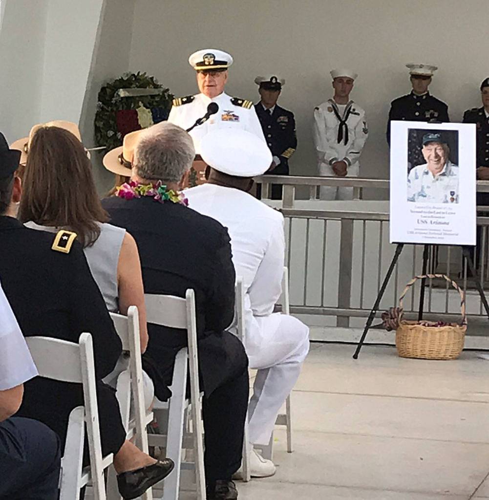 Photos courtesy Teri Mann Whyatt                                Above, USS Arizona survivor Lou Conter (center) speaks at interment of his shipmate and friend Lauren Bruner on Dec. 7 in Pearl Harbor, Hawaii. Bruners ashes were placed aboard the Arizona. Conter is one of three remaining survivors of the Arizona crew. All three have elected not to be interred on the ship. Below, Lauren Bruners brother, Chet Danforth, poses for a photo with Teri Mann Whyatt in Hawaii.