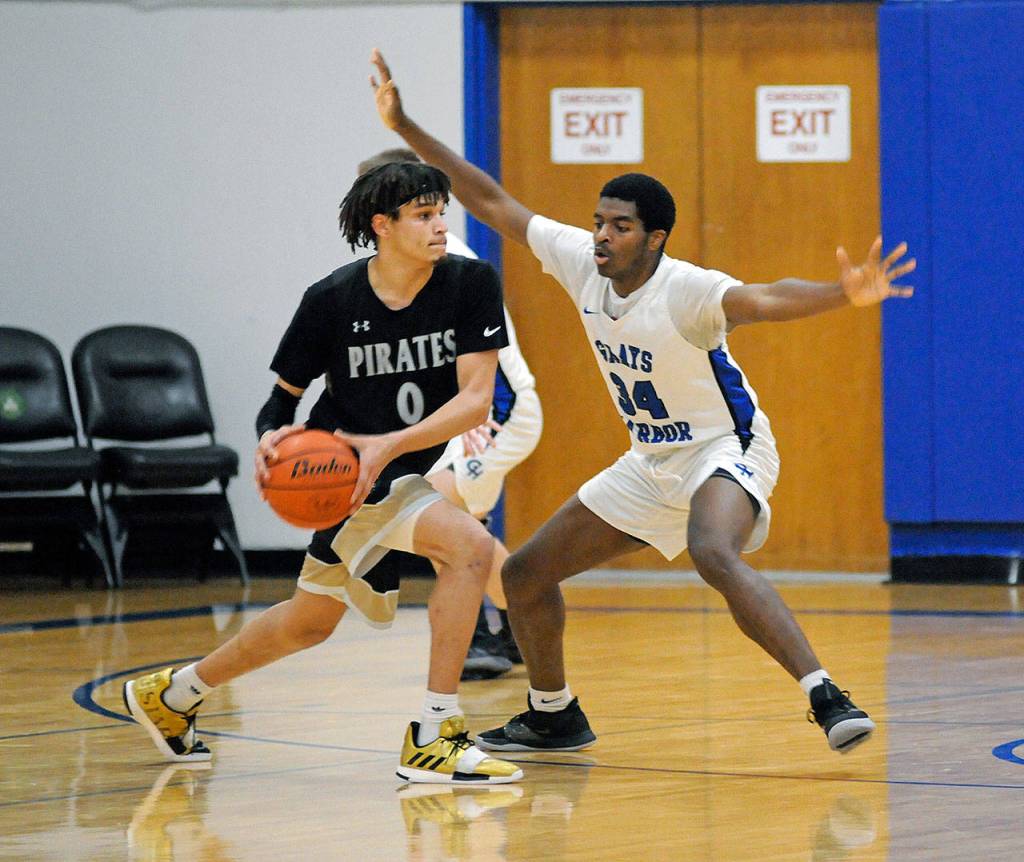 Grays Harbors Antoine Hine, right, defends Peninsulas Jaylin Reed during a Grays Harbor Crossover Tournament game on Sunday in Aberdeen. (Ryan Sparks | Grays Harbor News Group)