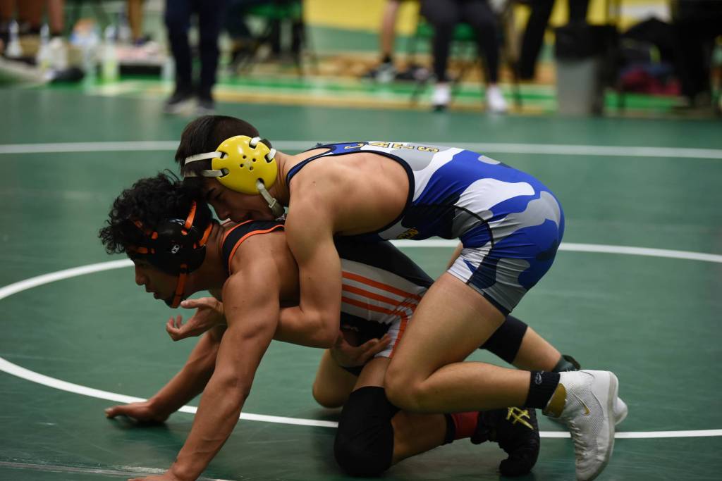 Aberdeens Drew Lock, top, wrestles Centralias Juan Gasper in the 120-pound title match of the Pat Alexander Invitational at Tumwater High School on Saturday. (Photo by Sue Michalak Budsberg)