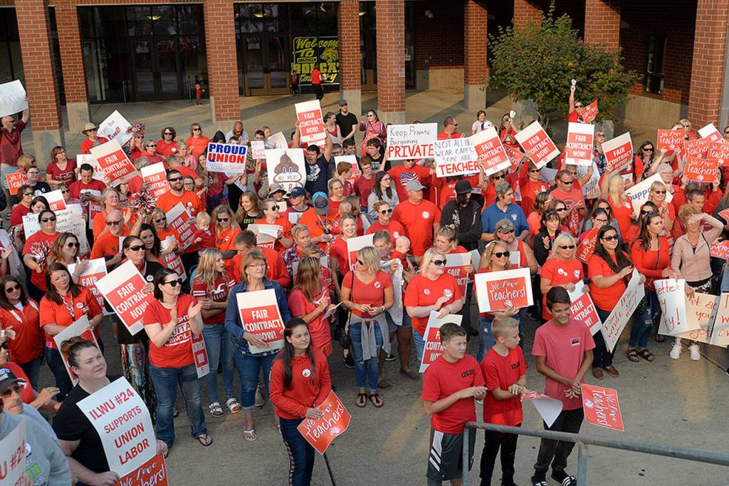 Louis Krauss | Grays Harbor news group                                Teachers, union and community members listen to Aberdeen Education Association President Michelle Reed during a boycott and rally at Aberdeen High School during school district contract negotiations.