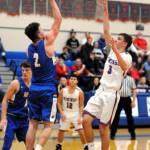 Willapa Valley guard Tyler Adkins (3) scores on a teardrop shot while Adnas Braden Thomas defends during the Vikings 46-40 victory on Saturday in Menlo. Adkins led Willapa Valley with 15 points. (Ryan Sparks | Grays Harbor News Group)