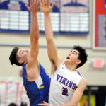 Willapa Valleys Logan Walker (2) rises for the opening tip against Adnas Braden Thomas during the Vikings 46-40 victory in the final game of the John Q. Pearson Holiday Classic on Saturday at Willapa Valley High School. (Ryan Sparks | Grays Harbor News Group)