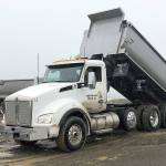 Photos COURTESY ARMY CORPS OF ENGINEERS                                Trucks from Northwest Rock Inc. are dumping sand on the breach fill area of Westports south jetty. Crews are about halfway through a project to shore up the spit between the jetty and the mainland.