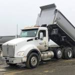 Photos COURTESY ARMY CORPS OF ENGINEERS                                Trucks from Northwest Rock Inc. are dumping sand on the breach fill area of Westports south jetty. Crews are about halfway through a project to shore up the spit between the jetty and the mainland.