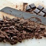 Photos by E. Jason Wambsgans | Chicago Tribune                                Use a serrated knife to shave the chocolate bar into thin pieces. This will make the chocolate melt more quickly when you pour the hot cream over it.