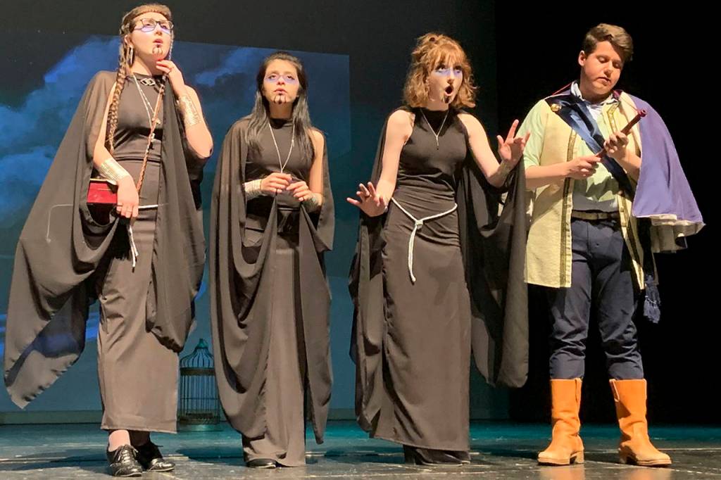 Photos by Kat Bryant | Grays Harbor News Group                                The Three Ladies (Alexandra Koski, Jasmin Torres and and Emma Dorsch) present the Magic Flute to Prince Tamino (Ryan Urvina).