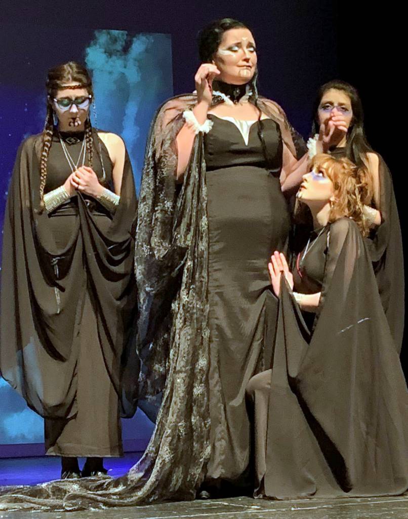 The Three Ladies (Alexandra Koski, Jasmin Torres and and Emma Dorsch) gather around the Queen of the Night (Analei Holt, center).