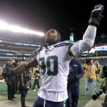 Seattle Seahawks DE Jadeveon Clowney (90) celebrates a 17-9 win after knocking out Philadelphia Eagles QB Carson Wentz. (Tribune News Service)