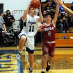 Elmas Nick Church drives the baseline against Hoquiams Abe Morales during the Grizzlies 52-50 victory on Friday in Elma. (Ryan Sparks | Grays Harbor News Group)