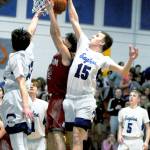 Elmas Brady Johnston blocks the shot of Hoquiams Garrett Dick during Fridays game at Elma High School. Hoquiam won 52-50. (Ryan Sparks | Grays Harbor News Group)