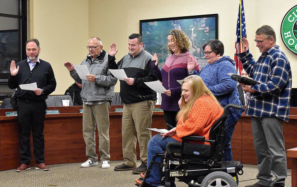 DAN HAMMOCK | GRAYS HARBOR NEWS GROUP                                Re-elected and newly-elected Hoquiam City Council members were sworn in prior to Mondays council meeting. From left: Steven Puvogel, Ward 2; new Ward 4 Councilman Al Dick; Dave Hinchen, Ward 6; Shannon Patterson, Ward 3; Brenda Carlstrom, Ward 5; Elizabeth Reid, Ward 6; and Dave Wilson, Ward 1.
