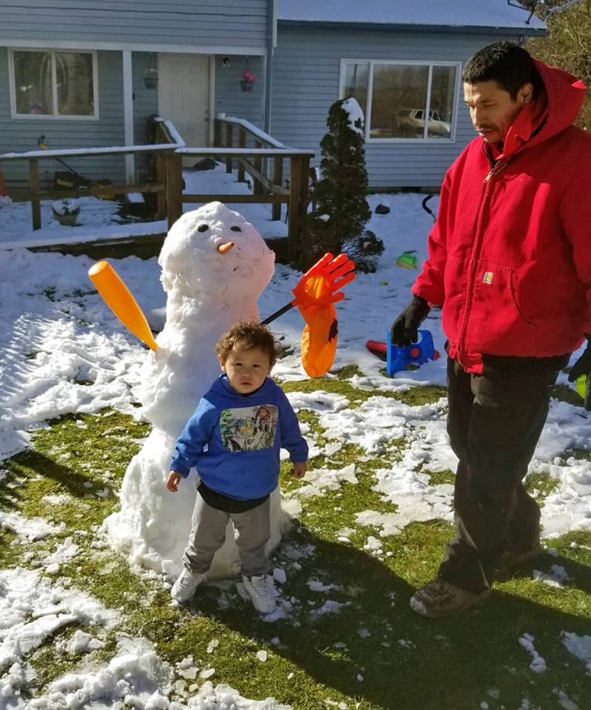 Kui Tahkeal Sr. photo                                Kaleonahe Kui-Lee Tadios-Tahkeal, left, made this snowman with his father, Kui Tahkeal Sr., at their Taholah home.
