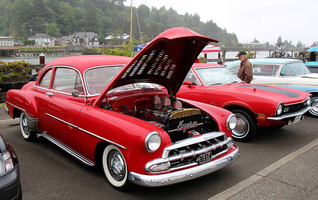 DAN HAMMOCK | THE DAILY WORLD                                 Dozens of classic cars and trucks line Levee Street in Hoquiam every summer during the annual Pushrods River Run car show.