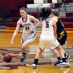Montesanos McKynnlie Dalan (34) dribbles around a screen from teammate Jaiden King (5) during the Bulldogs 69-44 victory on Thursday at Montesano High School. (Ryan Sparks | Grays Harbor News Group)
