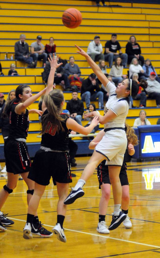 Aberdeen guard Annetthe Orona, right, scores on a leaning, one-handed shot in the third quarter of the Bobcats 58-39 loss to Tenino on Monday at Sam Benn Gym in Aberdeen. (Ryan Sparks | Grays Harbor News Group)